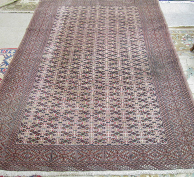 Appraisal: HAND KNOTTED ORIENTAL CARPET Indo-Turkoman featuring a rectangular field of