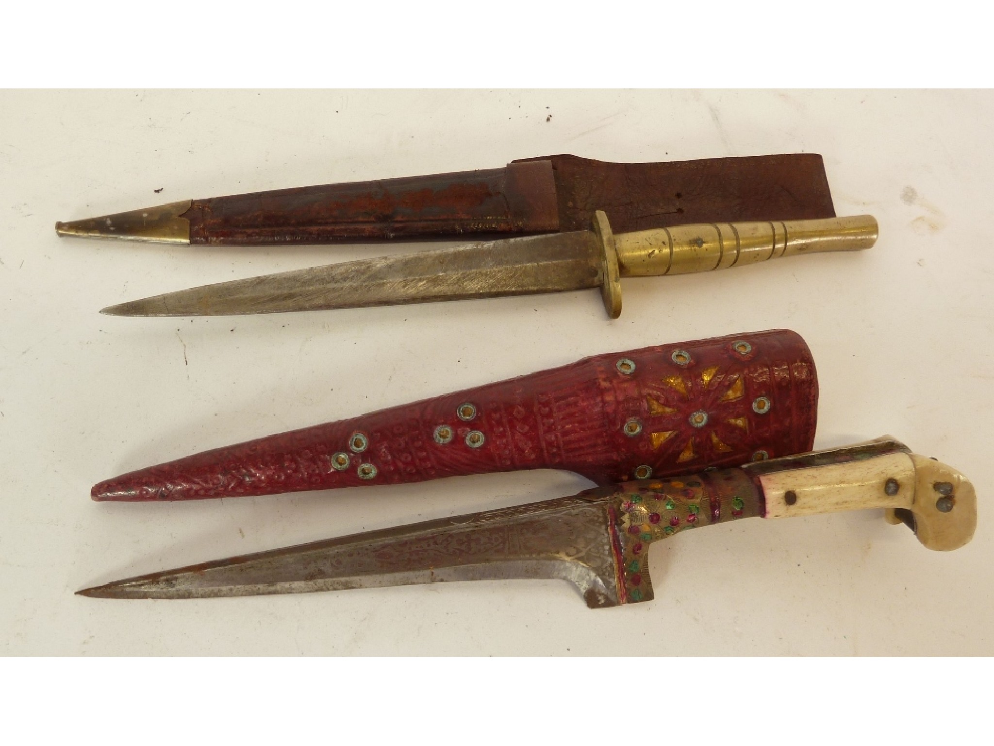 Appraisal: CRUDE MIDDLE EASTERN DAGGER with two part bone handle and