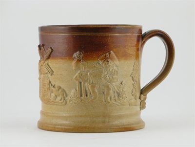 Appraisal: A brown stoneware beer mug with applied sprigs of Toby