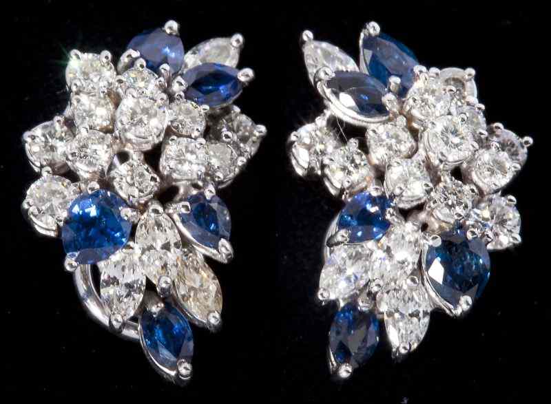 Appraisal: Diamond and Sapphire Earclipscluster set in white gold in leaf