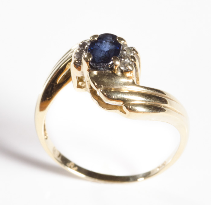 Appraisal: SAPPHIRE DIAMOND AND FOURTEEN KARAT GOLD RING set with six