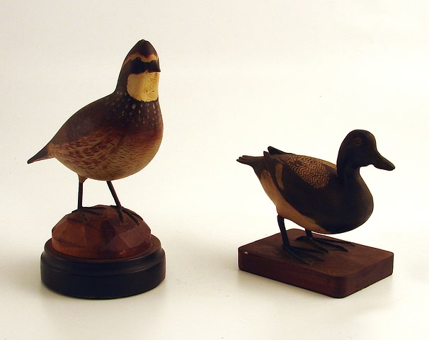 Appraisal: Two decorative carvings Miniature lesser scaup with legs attached to