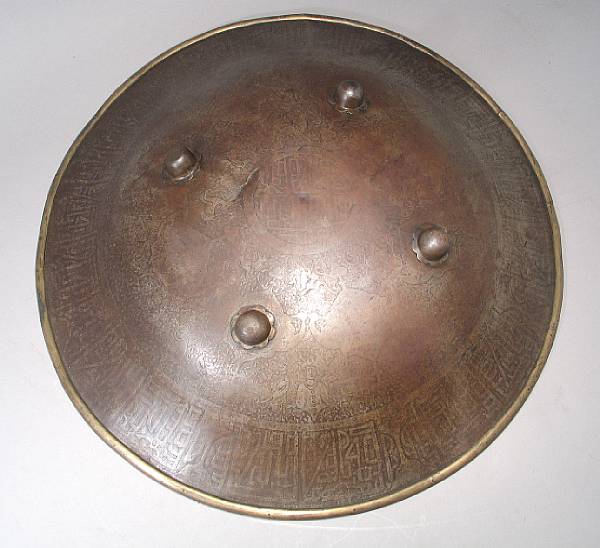 Appraisal: An Indo-Persian shield th century The circular domed shield etched