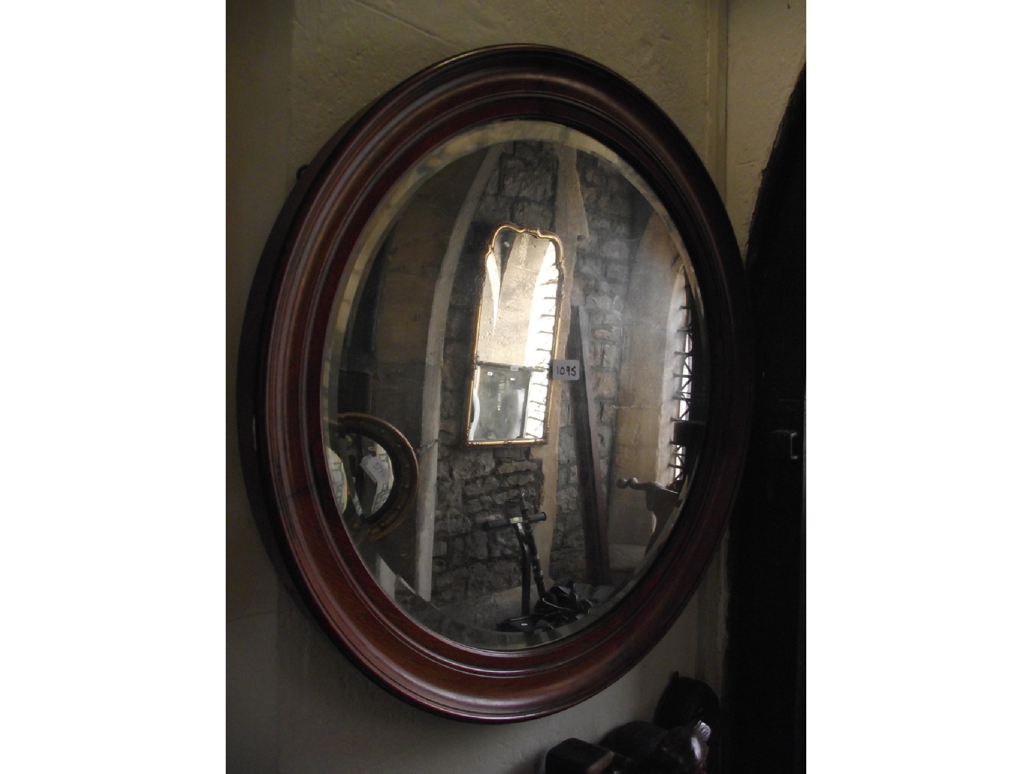 Appraisal: An Edwardian wall mirror of circular form with bevelled edge