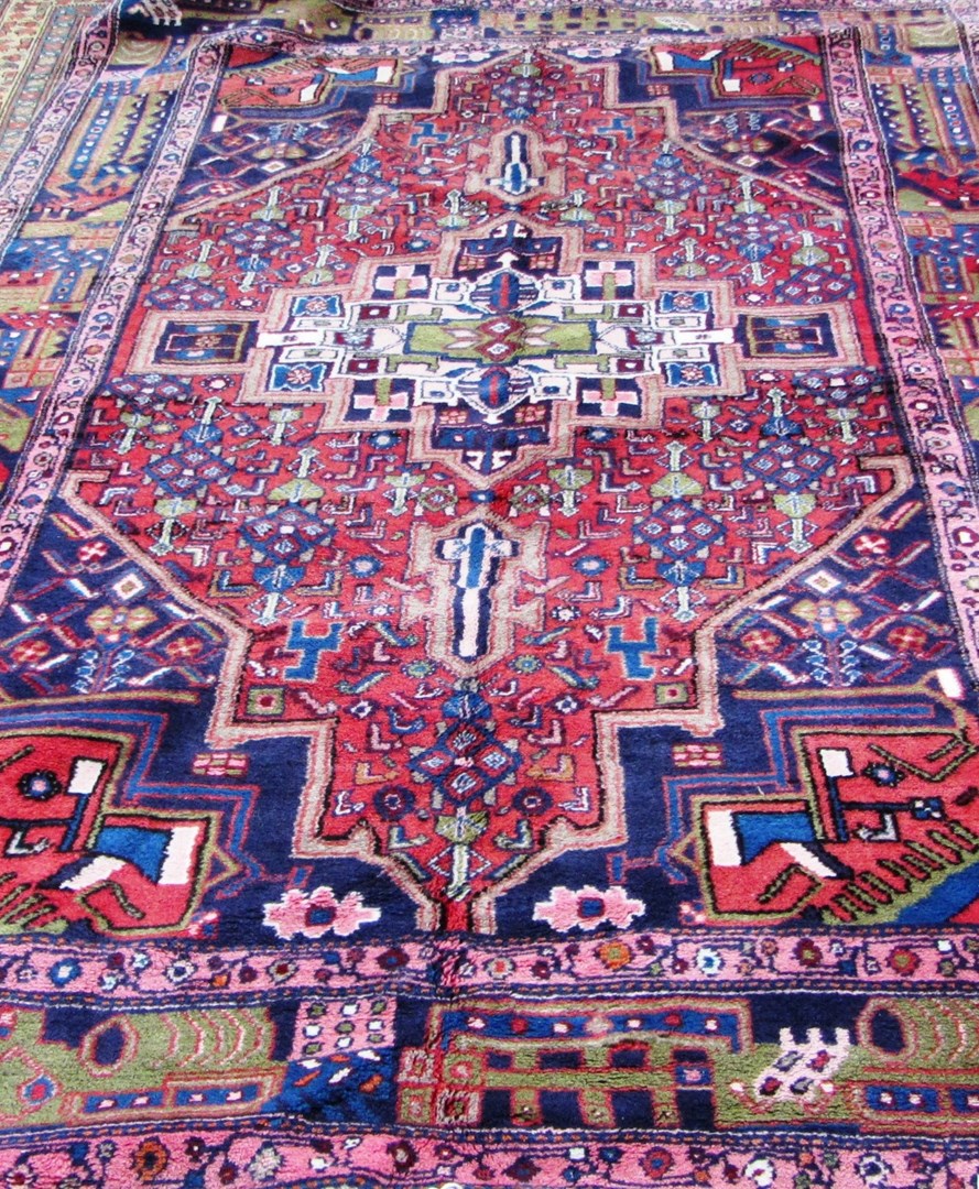 Appraisal: A West Persian rug the madder herate field with a