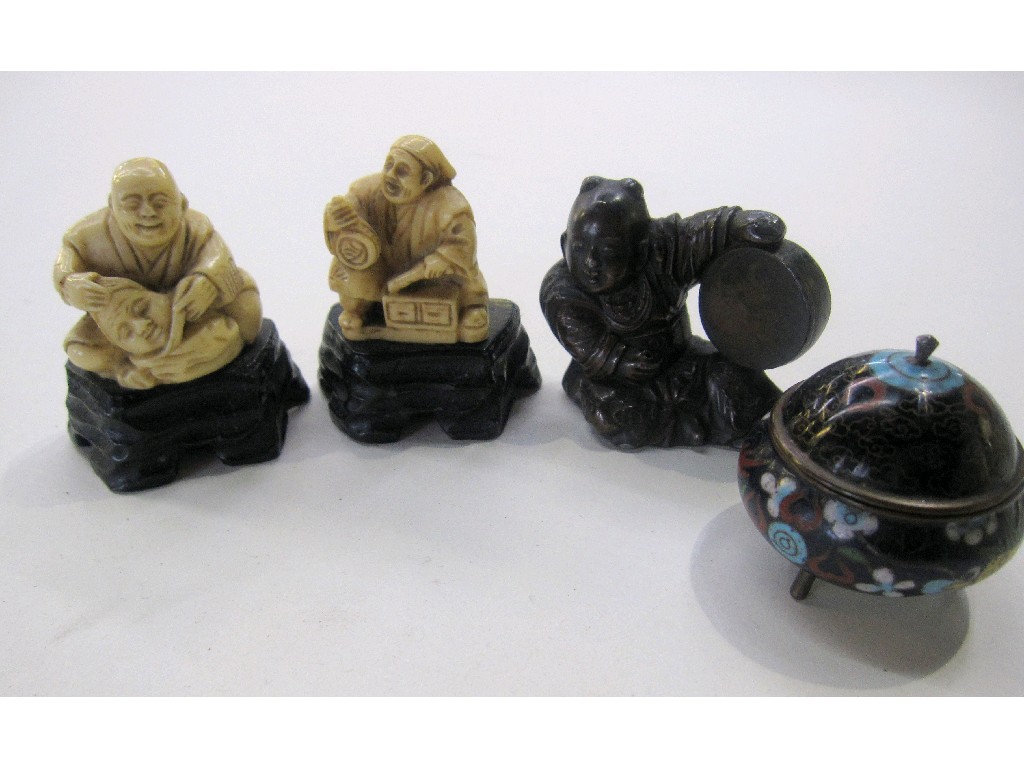 Appraisal: Lot comprising three oriental figures and a small cloisonne jar