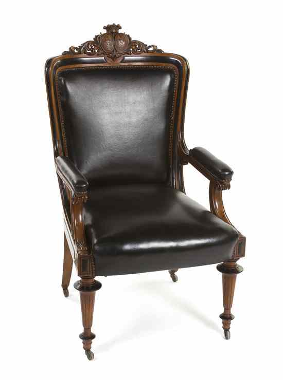 Appraisal: An English Victorian Open Armchair having crowned double armorial and