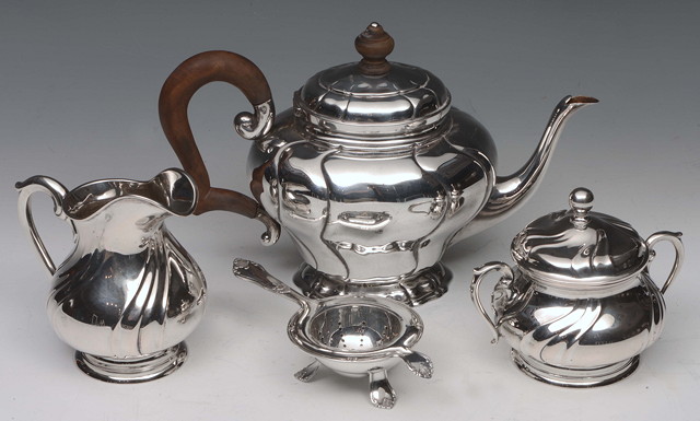 Appraisal: A CONTINENTAL GRADE SILVER THREE PIECE TEA SET with wrythen