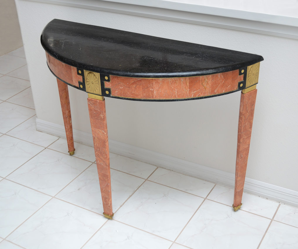 Appraisal: MARBLE DEMI CONSOLE TABLE Black marble top over salmon marble