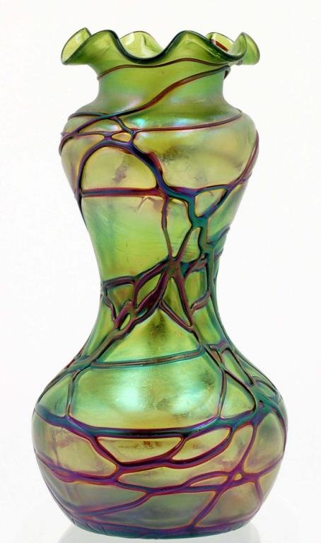 Appraisal: Natural free form green glass vase with red overlays in