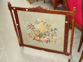 Appraisal: A Victorian mahogany and needlework fire screen damage to one