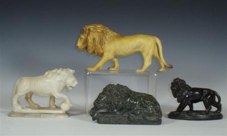 Appraisal: A group of four various lion figurines comprising a Coalport