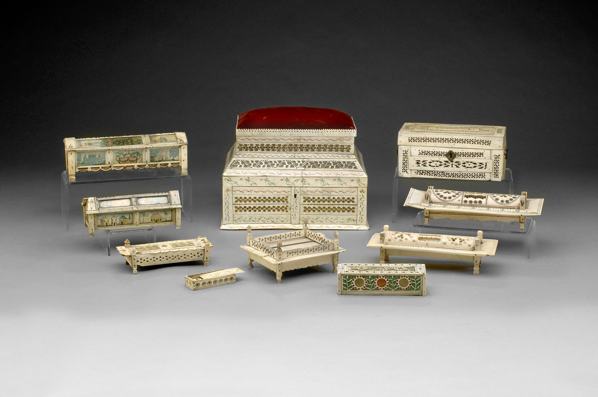 Appraisal: THREE PRISONER OF WAR CARVED IVORY DOMINO BOXES WITH CARVED