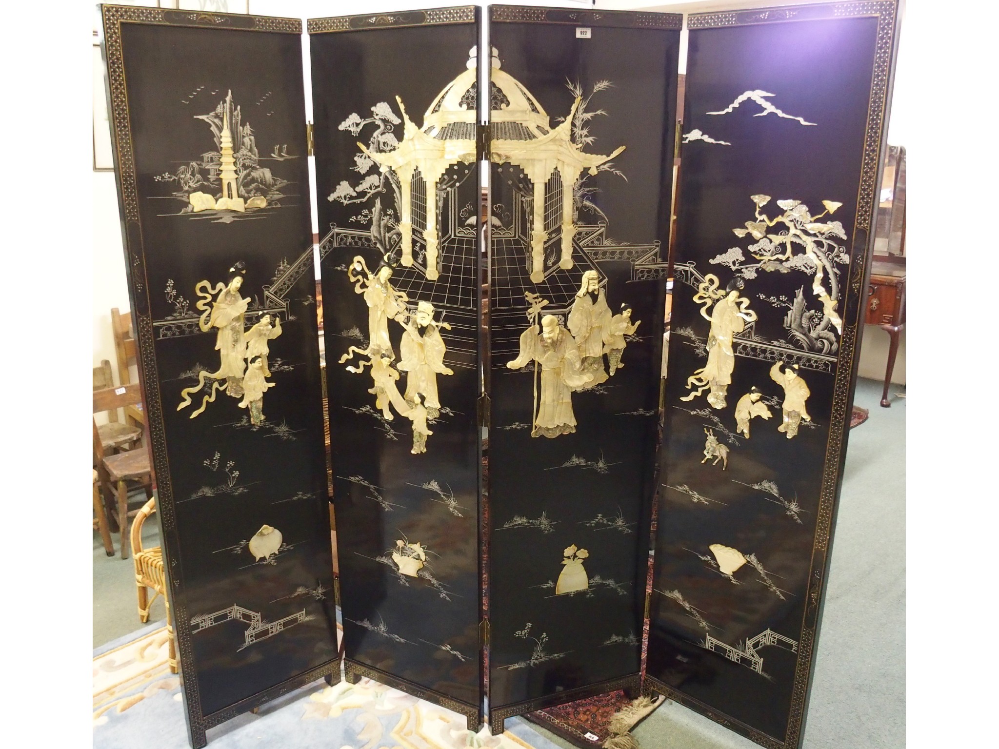 Appraisal: A four-fold Chinese black lacquered screen