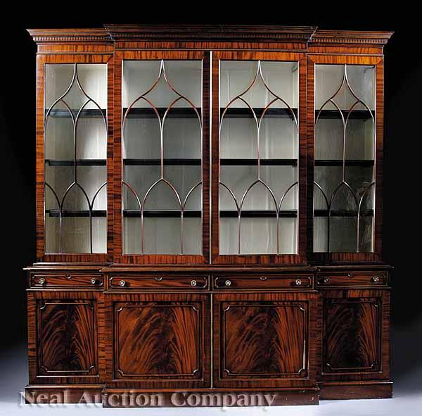 Appraisal: A George III-Style Mahogany Breakfront Bookcase molded dentillated cornice glazed