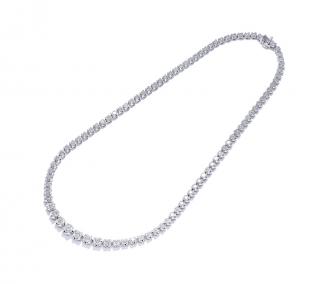 Appraisal: A GRADUATED CARAT DIAMOND LINE NECKLACE Graduated round-cut diamond line