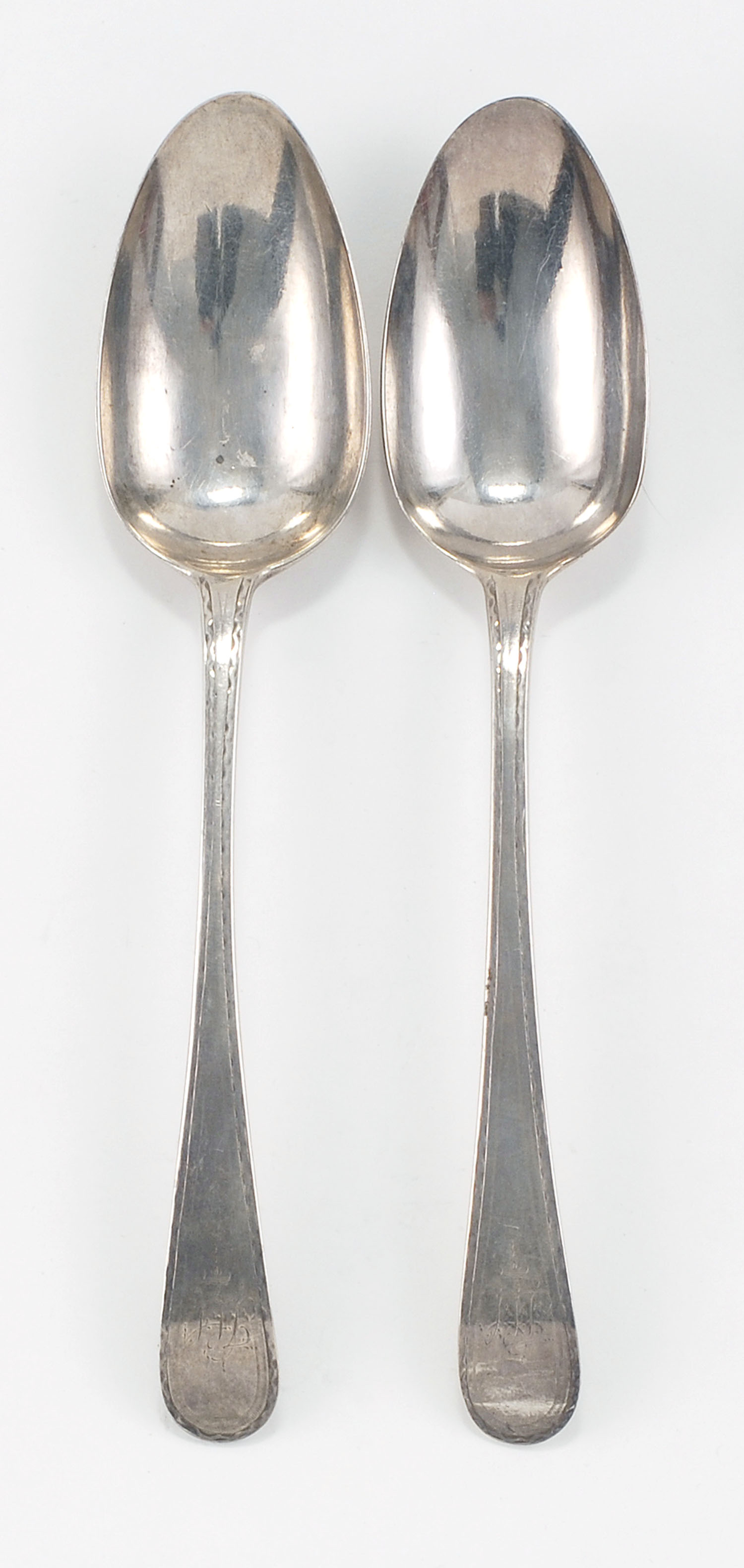 Appraisal: TWO HESTER BATEMAN SILVER PLACE SPOONS London With back-tipt handles