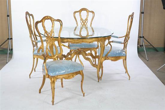 Appraisal: TABLE AND ARMCHAIRS Metal with gold paint Table has a