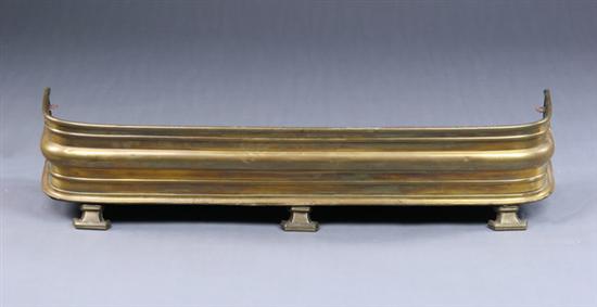 Appraisal: BRASS FIREPLACE FENDER early th century With raised and molded