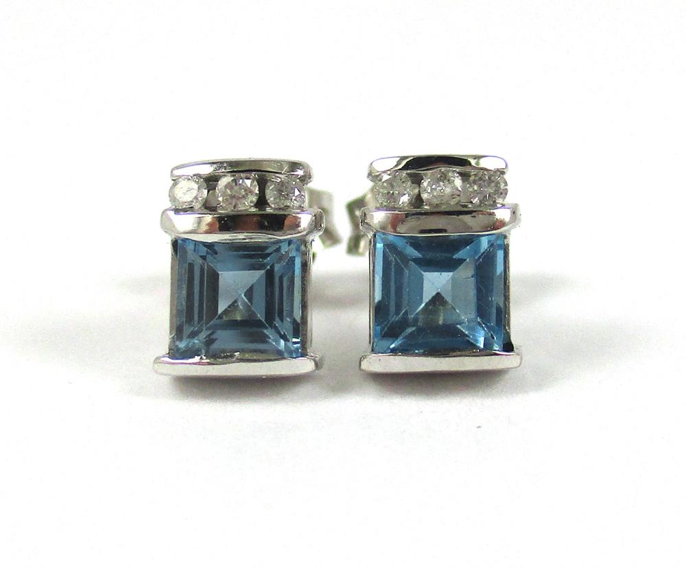 Appraisal: PAIR OF BLUE TOPAZ AND DIAMOND STUD EARRINGS each k