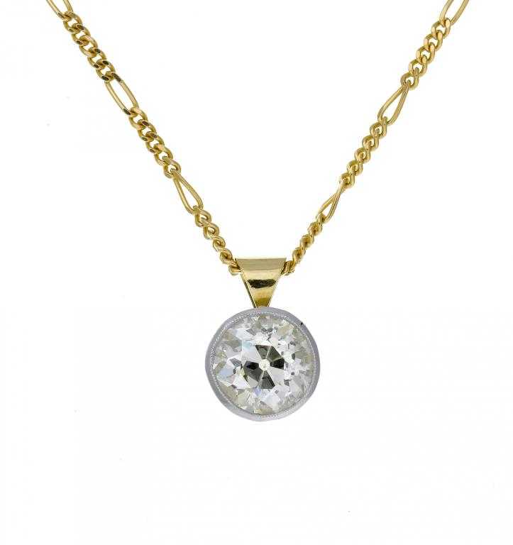 Appraisal: A DIAMOND PENDANT with a colleted round brilliant cut diamond