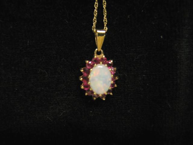 Appraisal: Opal Ruby Pendant fiery oval gem surrounded by rubies k