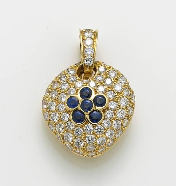 Appraisal: A diamond sapphire and k gold pendant estimated total diamond