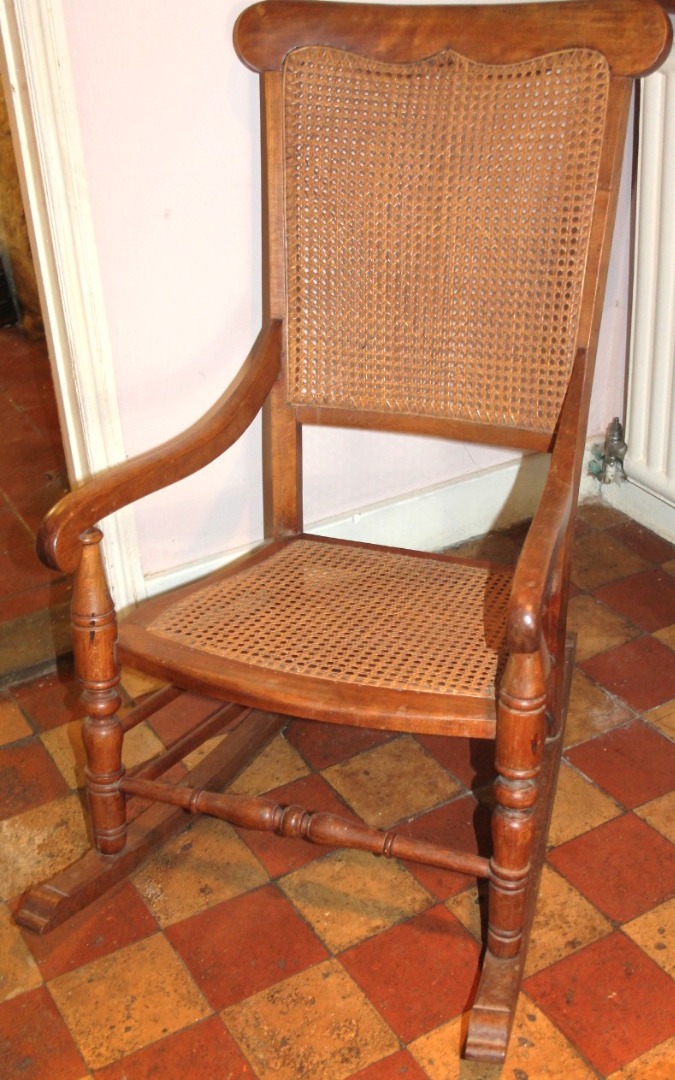 Appraisal: A Victorian beech rocking chair with caned back