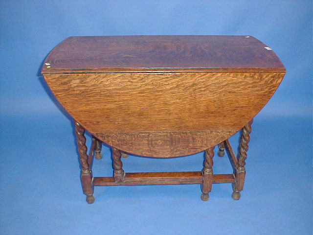 Appraisal: A barley twist oak gate leg table