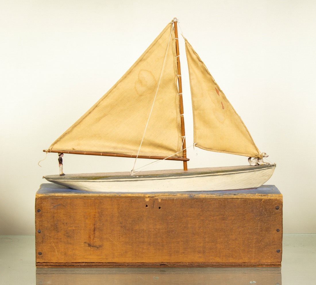 Appraisal: FOLK ART SAILBOAT MODEL WITH FIGURE AND DOG FITS INTO