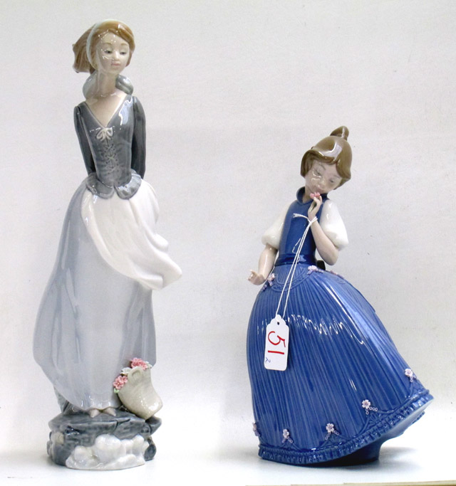 Appraisal: TWO LLADRO PORCELAIN FIGURINES Sea Breeze sculptor Salvador Debon issued