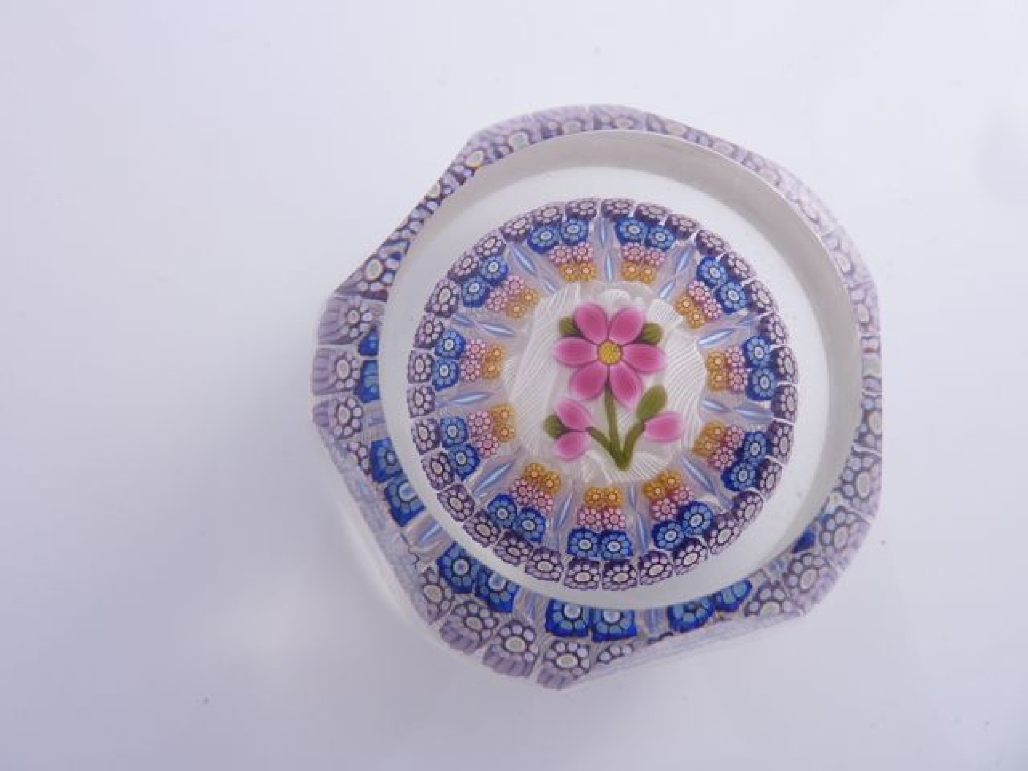 Appraisal: A six faceted Perthshire Millefiori paperweight dated decorated with a