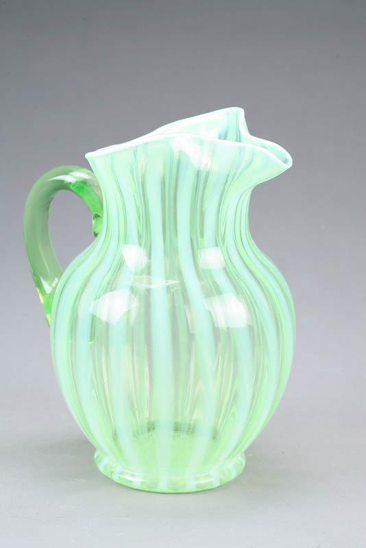 Appraisal: OPALESCENT GLASS PITCHER Pale green with vertical stripes and applied