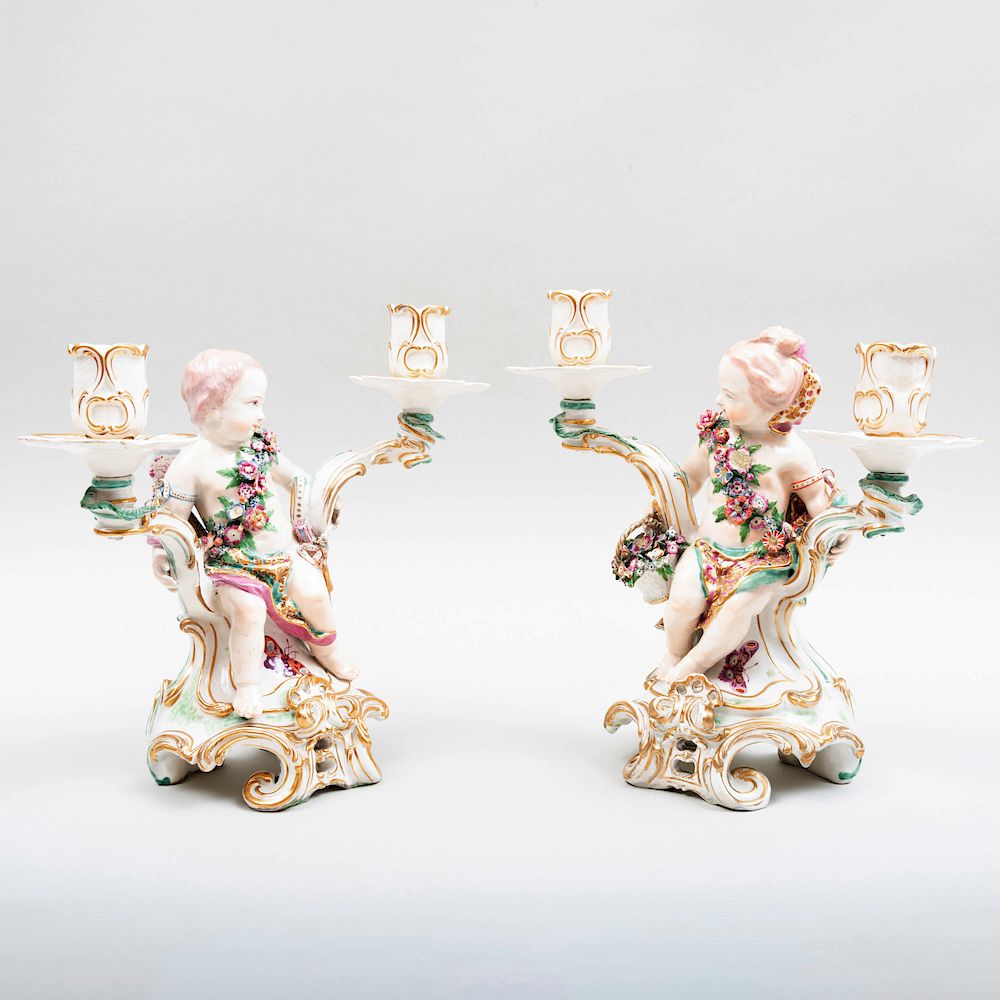 Appraisal: Pair of Chelsea Porcelain Two-Light Figural Candelabra with Putti Gold