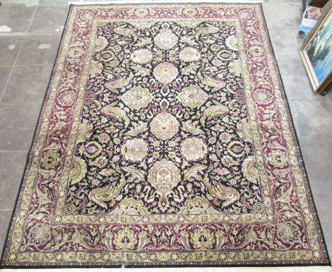 Appraisal: HAND KNOTTED ORIENTAL CARPET Indo-Persian overall floral design on dark