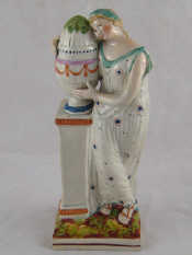 Appraisal: An early th century pearlware figure of a classical maiden