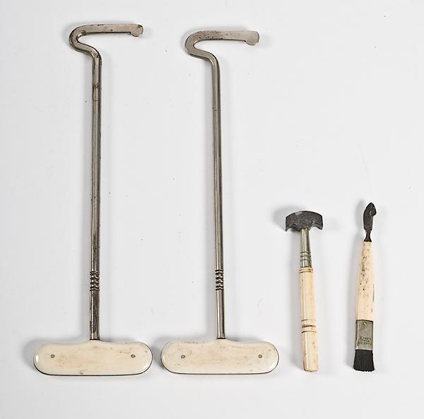 Appraisal: IVORY BOOT HOOKS AND TOOLS th century steel and ivory