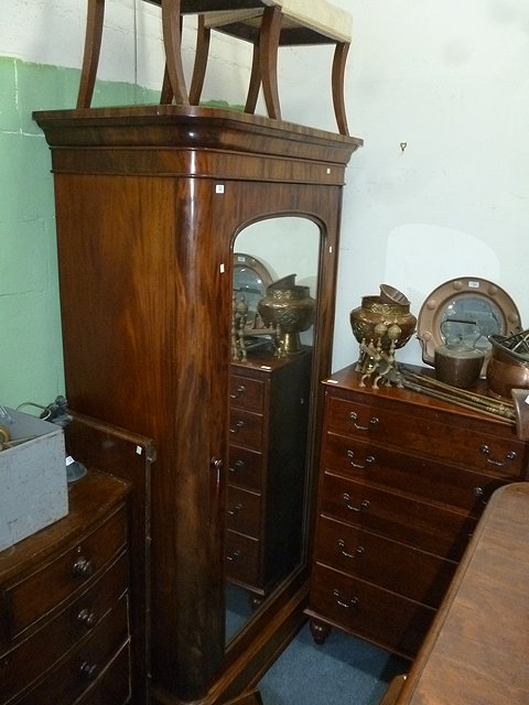 Appraisal: A VICTORIAN MAHOGANY WARDROBE with single mirrored door standing on