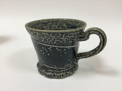 Appraisal: Walter Keeler British born a saltglaze teacup with incised diagonal