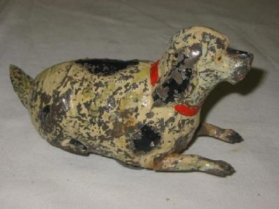 Appraisal: A novelty barking dog toy painted tin plate clockwork motor