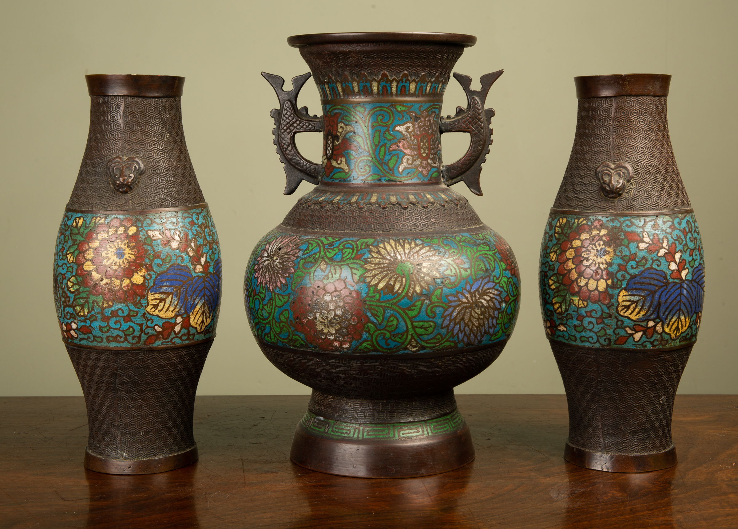 Appraisal: A group of three Japanese bronze and cloisonn decorated vases