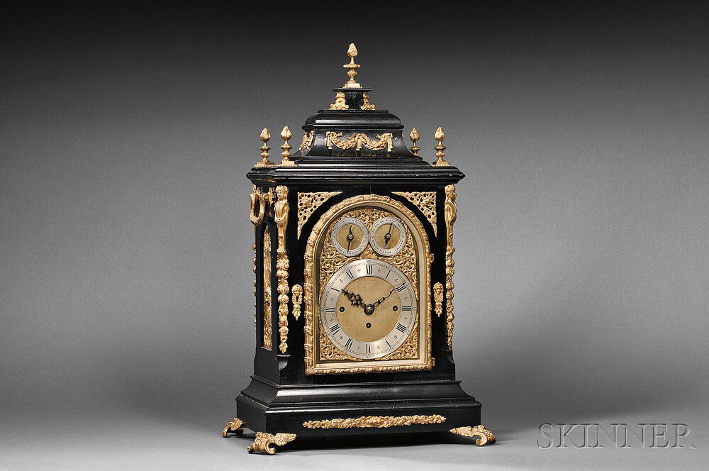 Appraisal: English Quarter-chiming Library Clock the ebonized case with sarcophagus top