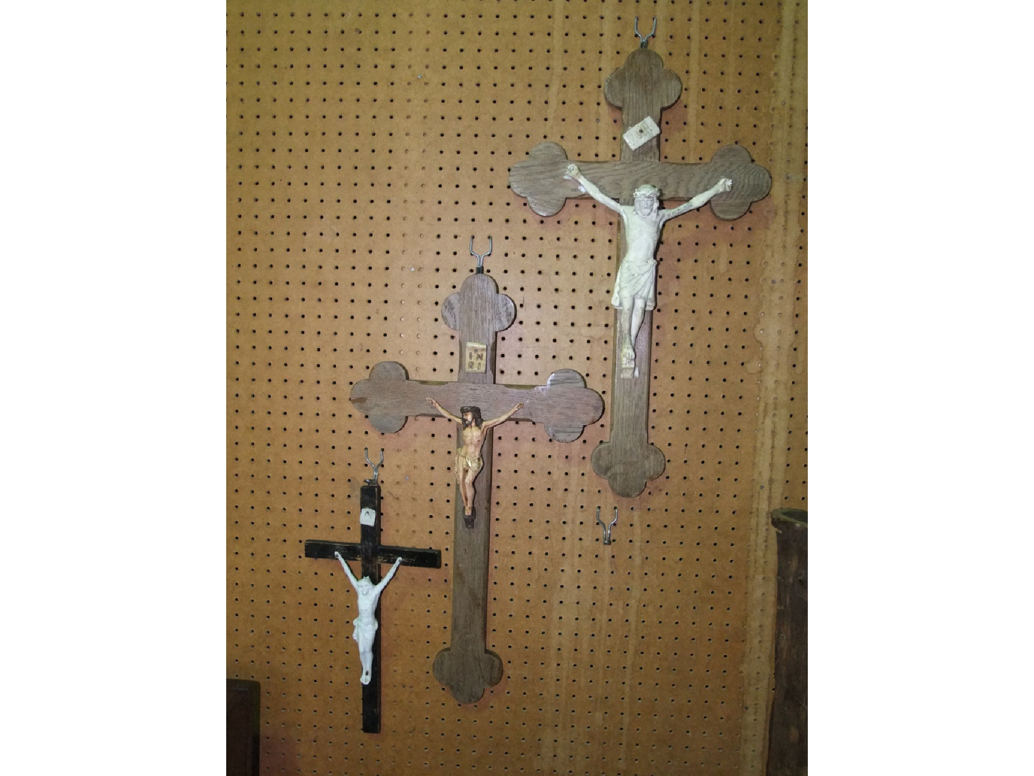 Appraisal: Three varying crucifix all timber backed the largest x cm