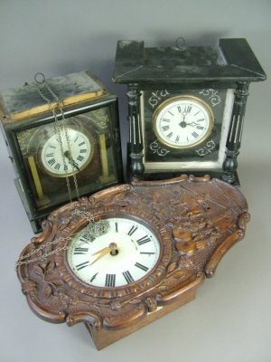 Appraisal: A Continental wooden cased wall clock the case with carved