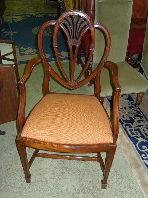 Appraisal: A set of six mahogany dining chairs with shield shaped