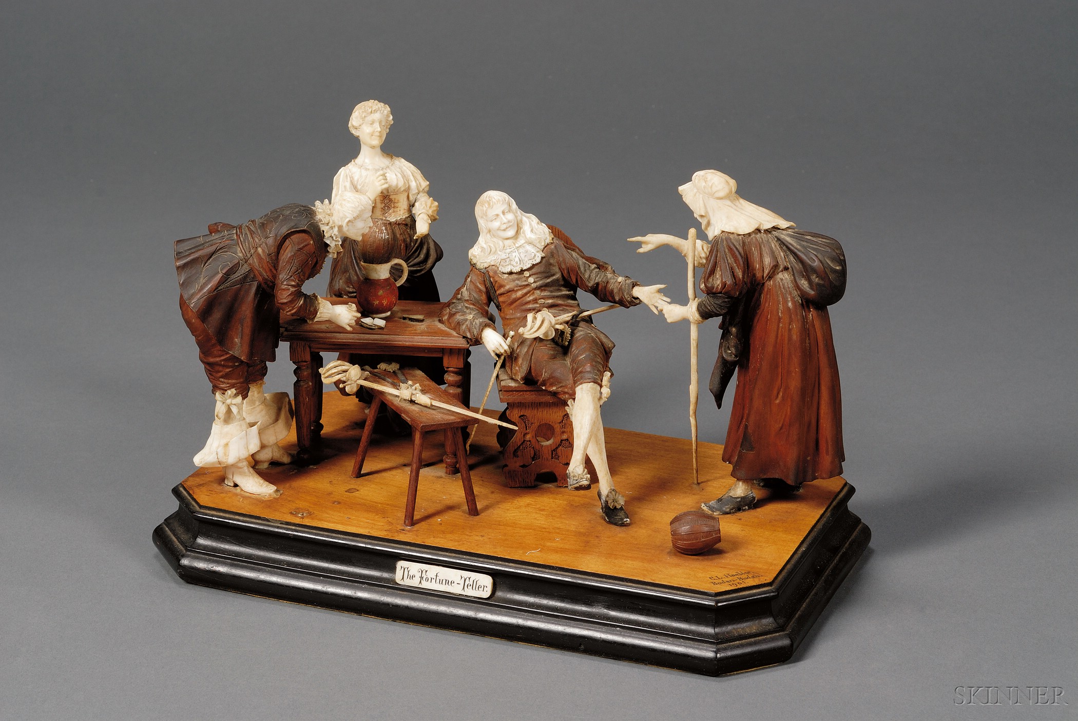 Appraisal: German Carved Fruitwood and Ivory Figure Group The Fortune Teller