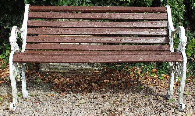 Appraisal: A GARDEN SEAT with white painted cast aluminium ends with