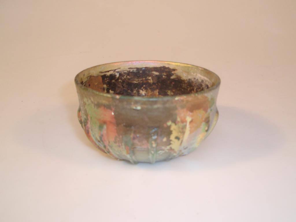 Appraisal: A Roman deep 'pillar-moulded' ribbed bowl cast in light green