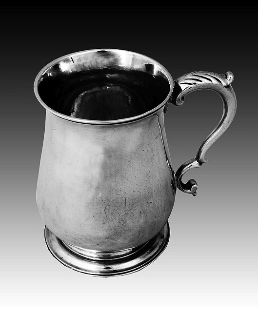 Appraisal: A GEORGE III SILVER BALUSTER SHAPED HALF PINT SIZED TANKARD