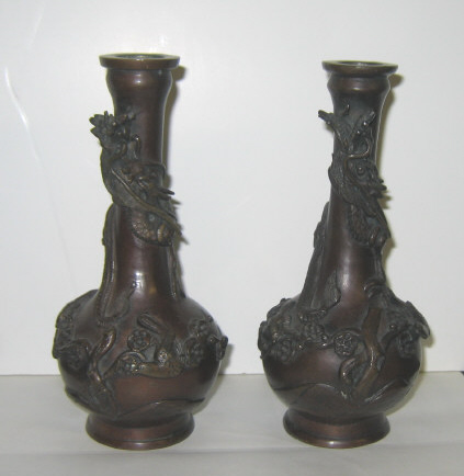 Appraisal: PAIR OF JAPANESE BRONZE VASES Each bottle form with high